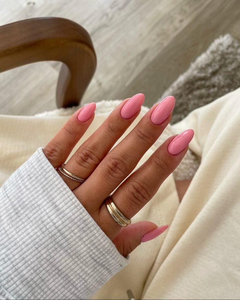 bright mochi pink nails on long almond shape, glossy fall 2026 manicure