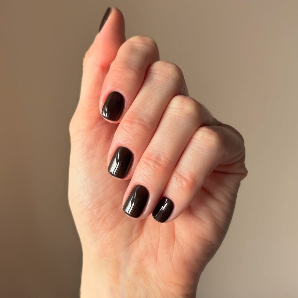 dark espresso November nails, near-black glossy brown manicure on short nails