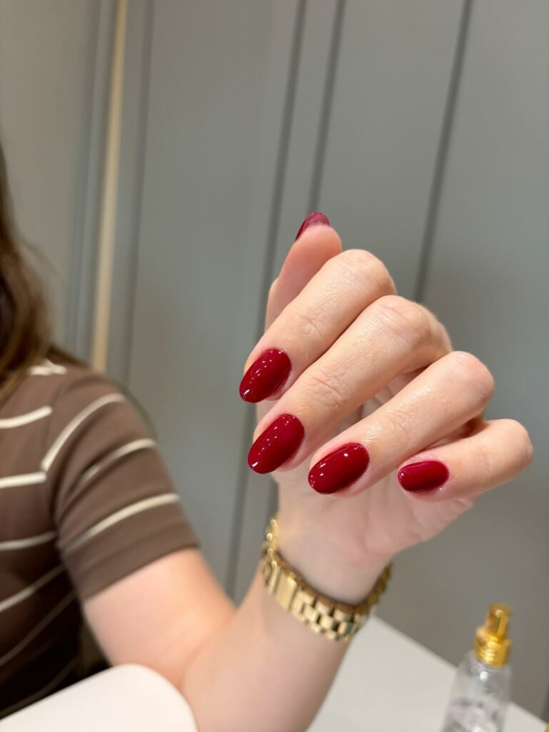 deep cherry red nails on oval shape, glossy dark red fall 2026 manicure