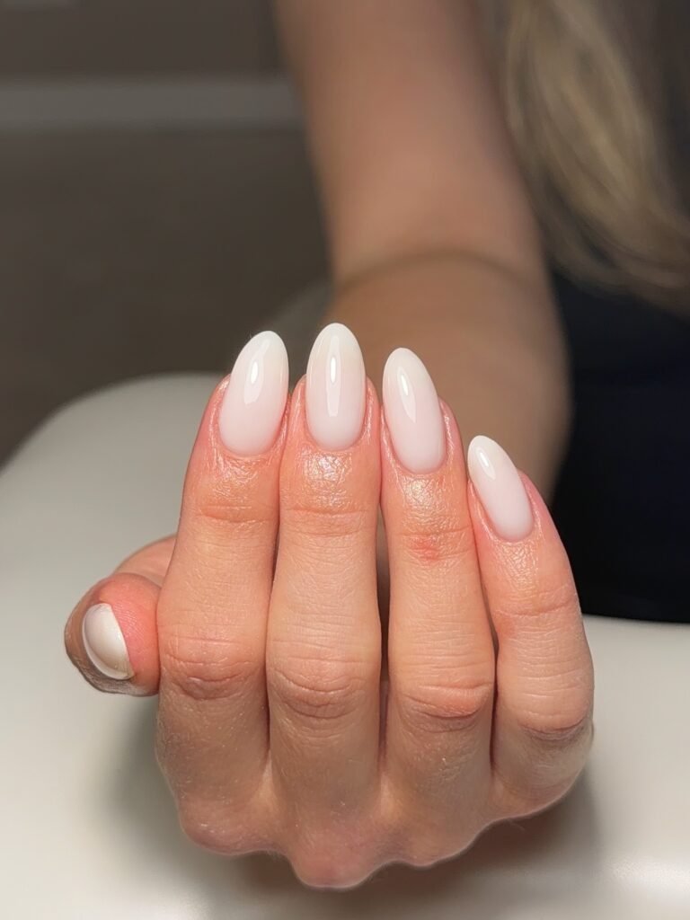 milky white cloud nails on almond shape, glossy sheer November 2026 manicure